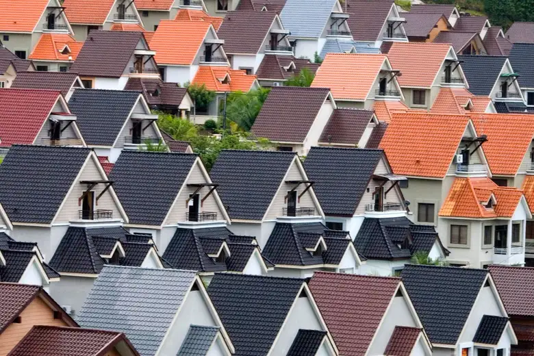 A vivid array of suburban rooftops in different colours and roofing styles