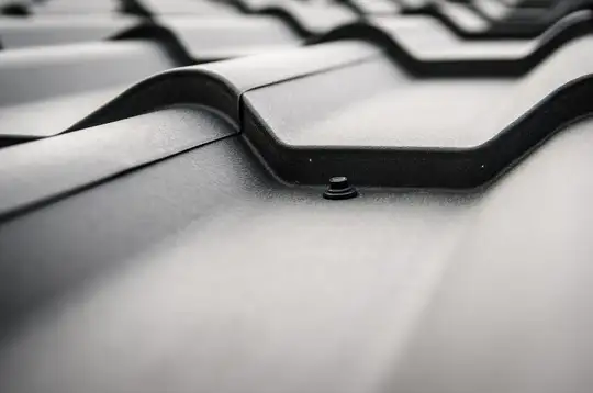 Close-up of a dark steel roof, a versatile-style metal roof