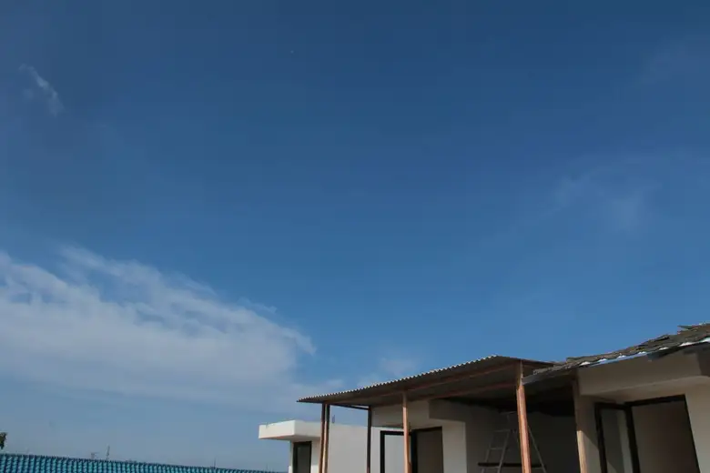 Minimalist modern house roofline against a clear sky